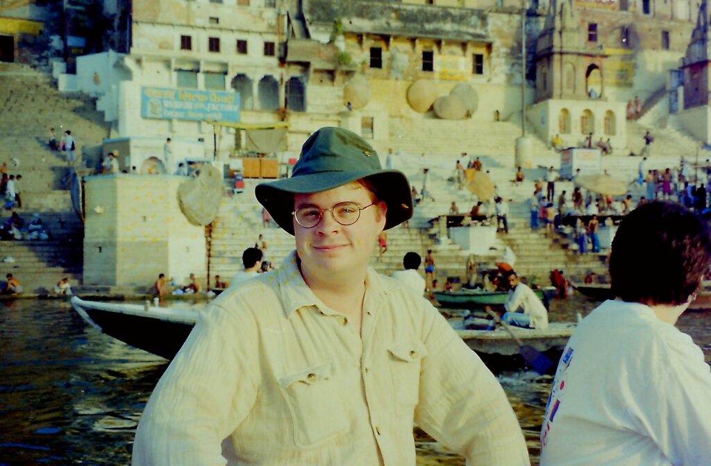 David Macdonald on his first trip to India in 1997, on the Ganges River, in Varanasi.